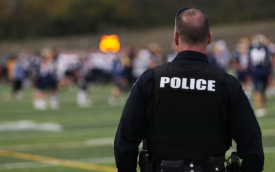 Re-evaluating the Cost and Consequences of Cops in Schools