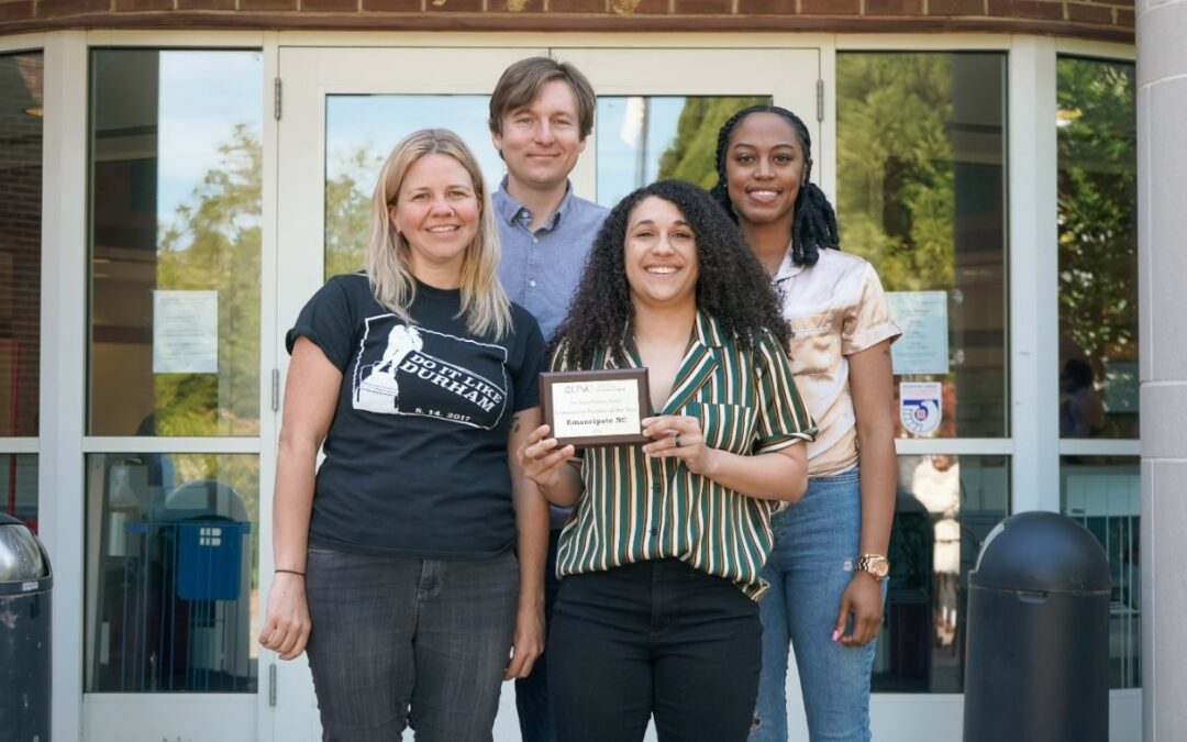 Team Emancipate's Elizabeth, Ian, Jaelyn, and Toia pose with award